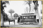 A fine art print from an antique photograph.  An image of a Florida East Coast Trolley on Palm Beach Island.  Available print only or framed.