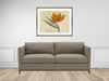 Room scene orange crush collection with bird of paradise fine art print and sofa